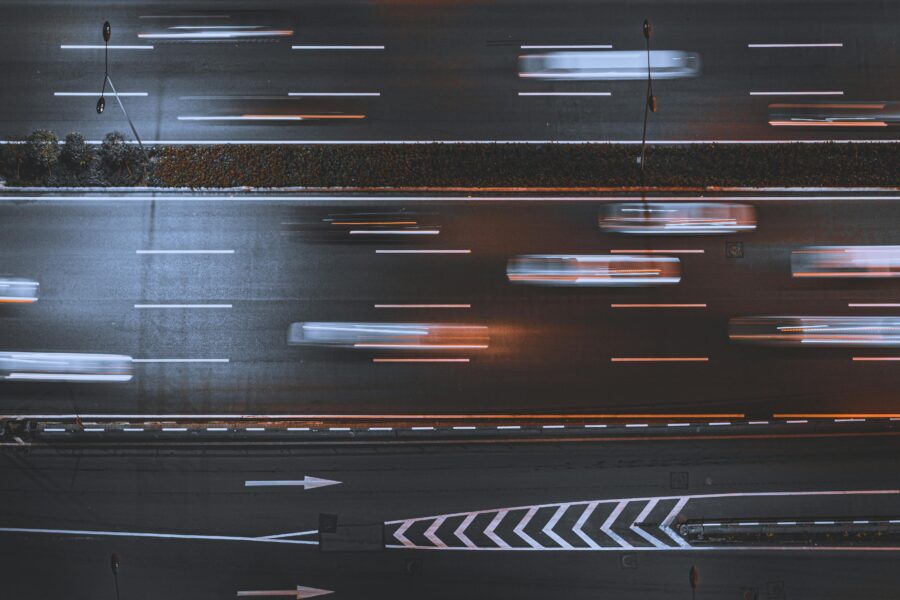 Aerial view of cars speeding on a highway